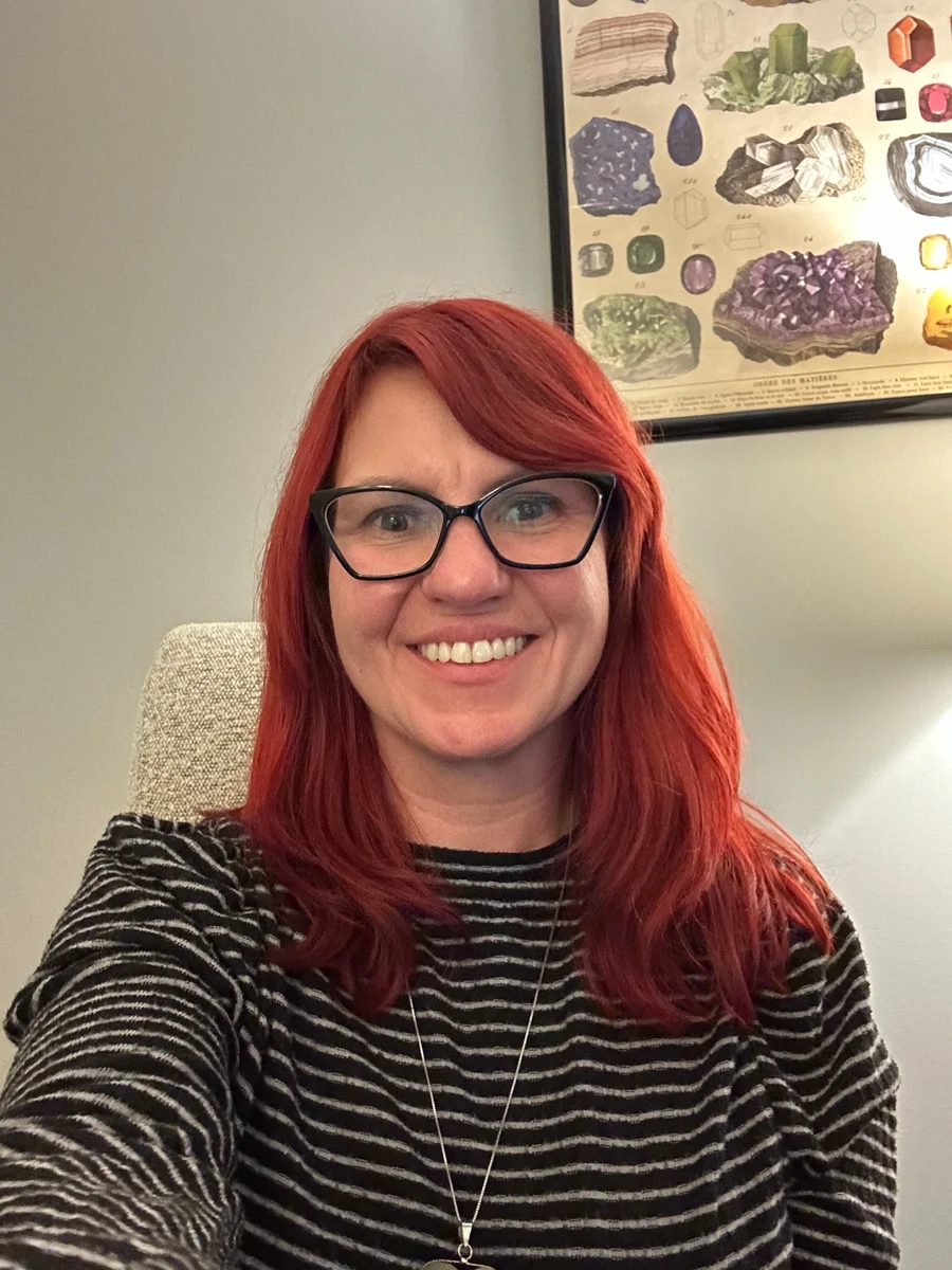 Airielle Banaszak smiling in office