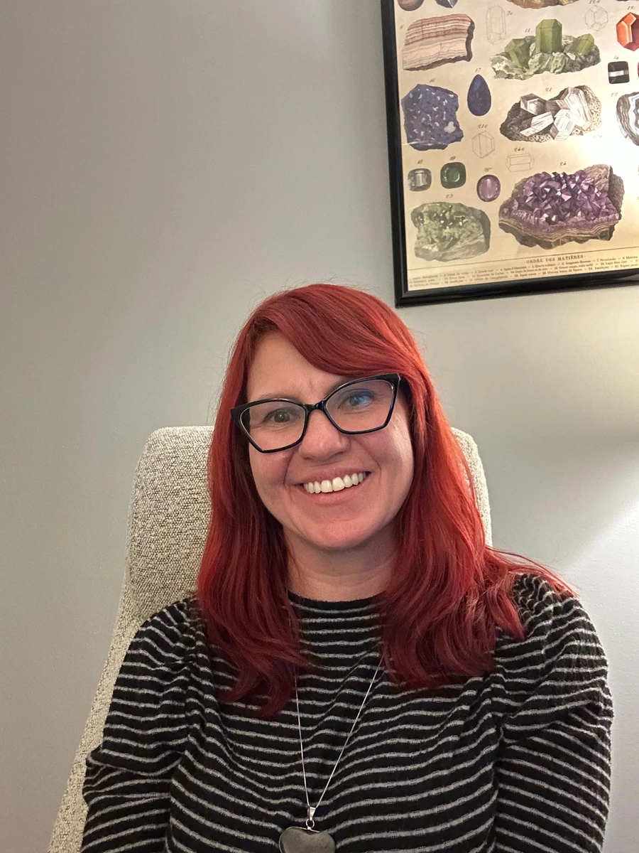 Airielle Banaszak smiling in her office